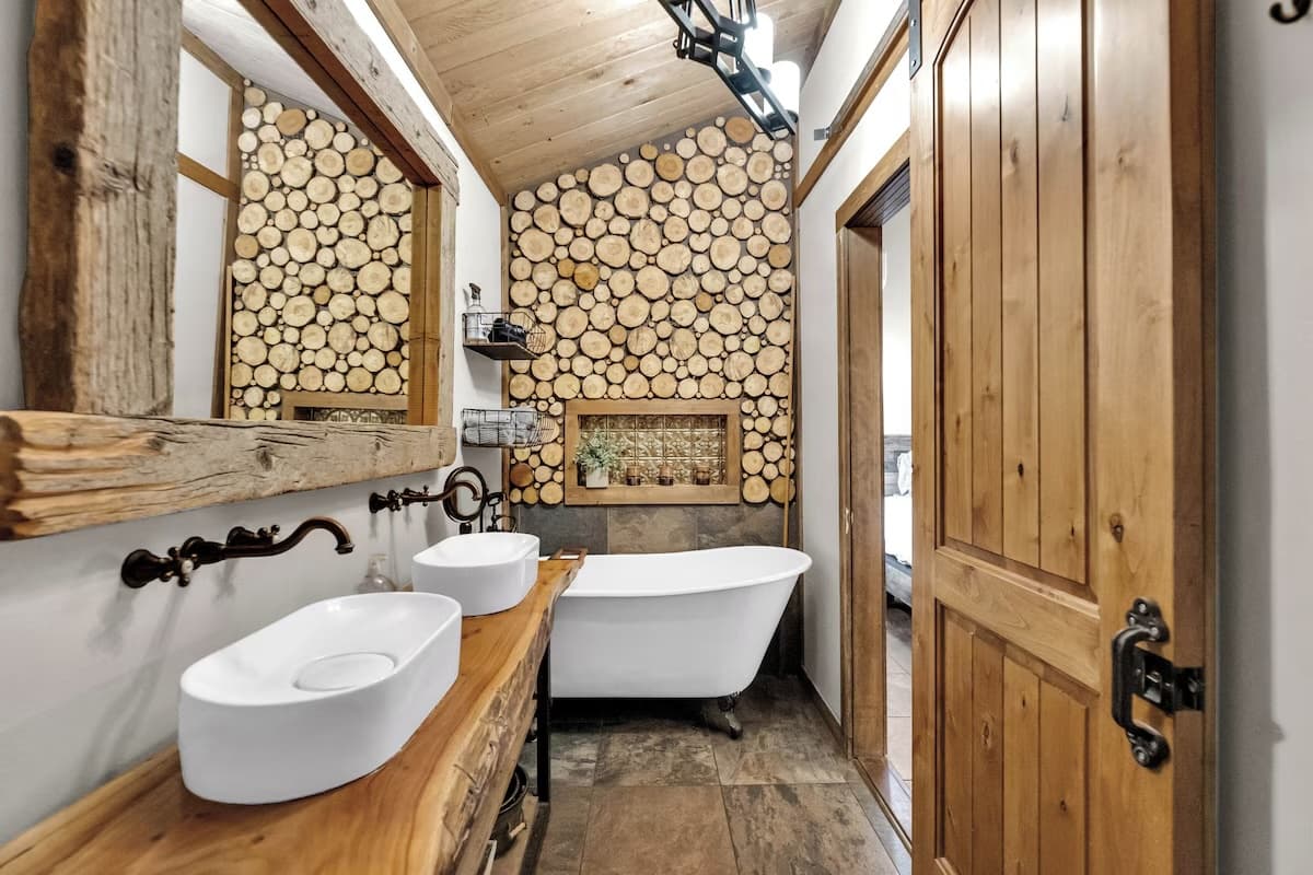 Bathroom with soaking tub and wood accent wall